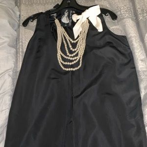 Black mini dress, with pearls attacked